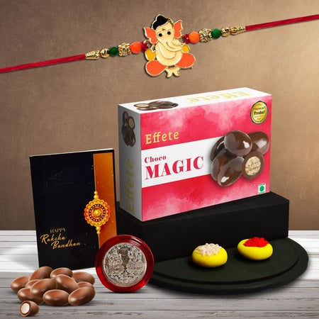 Multicolor Orange Rakhi  Bracelet (K1_255_cm32)  Chocolate Magic 32gm With Silver Color Pooja Coin Roli Chawal  Greeting Card  Occasion  Rakhi For Brother With Gift  Rakhi With Chocolate Rakhi Combo For Brother  Set Of 1 Rakhi  Rak