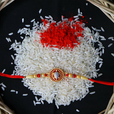 Elegant Om Rakhi With Intricate Meenakari Work And Beaded Thread