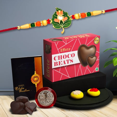 Multicolor Leaf Shped Rakhi  Bracelet (K1_307_cb32)  Chocolate Beats 32gm With Silver Color Pooja Coin Roli Chawal  Greeting Card Occasion Rakhi Combo With Card And Chocolate Chocolates Gift Pack Rakhi  Chocolate For Brother Rakhi